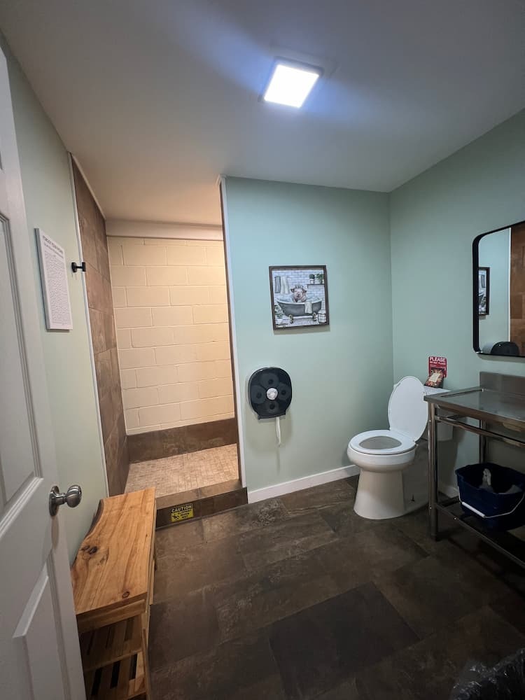 CLEAN SHOWERS AND BATHROOMS