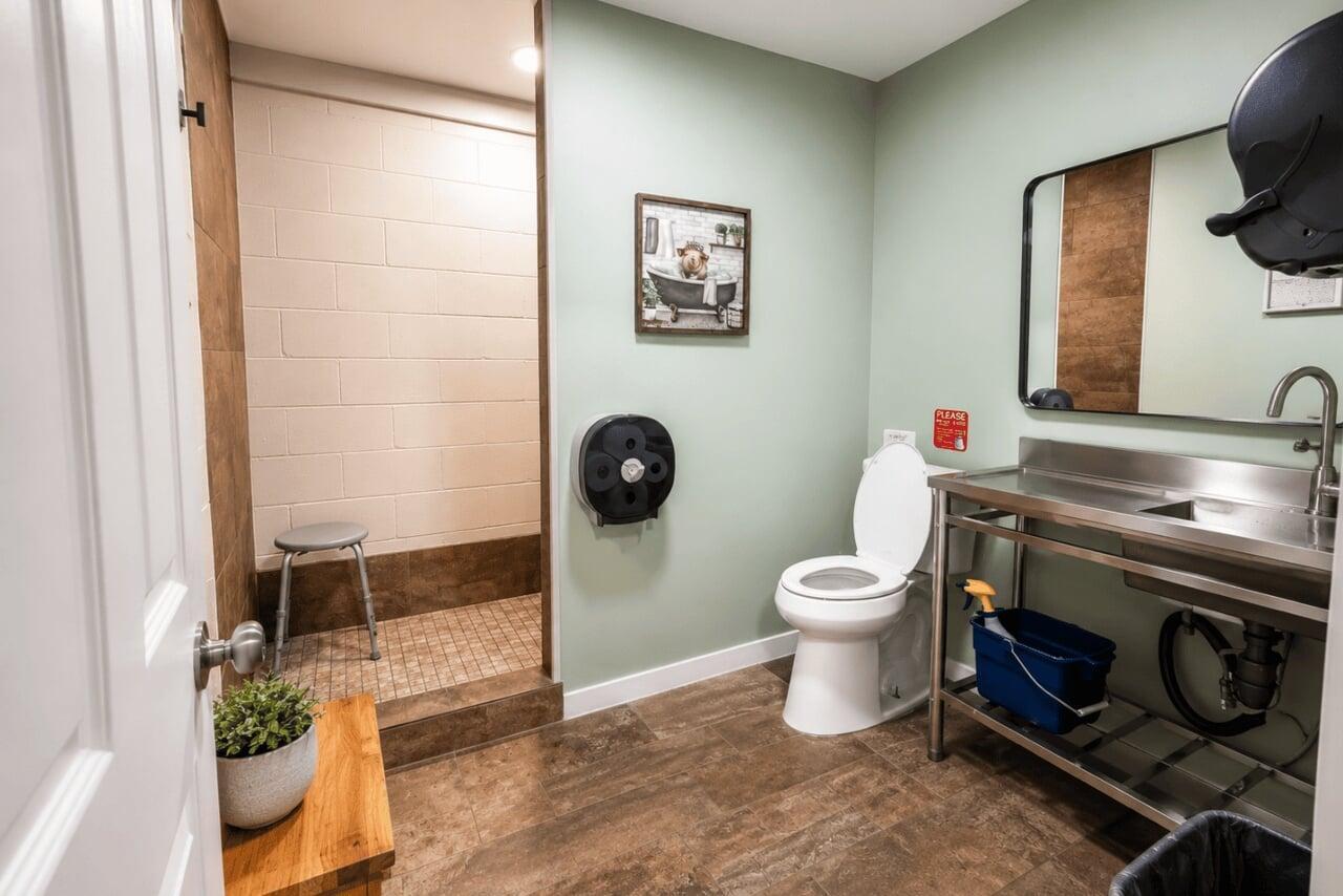CLEAN SHOWERS AND BATHROOMS